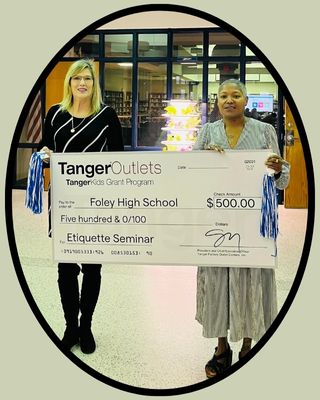  Ms. Howard receiving grant check